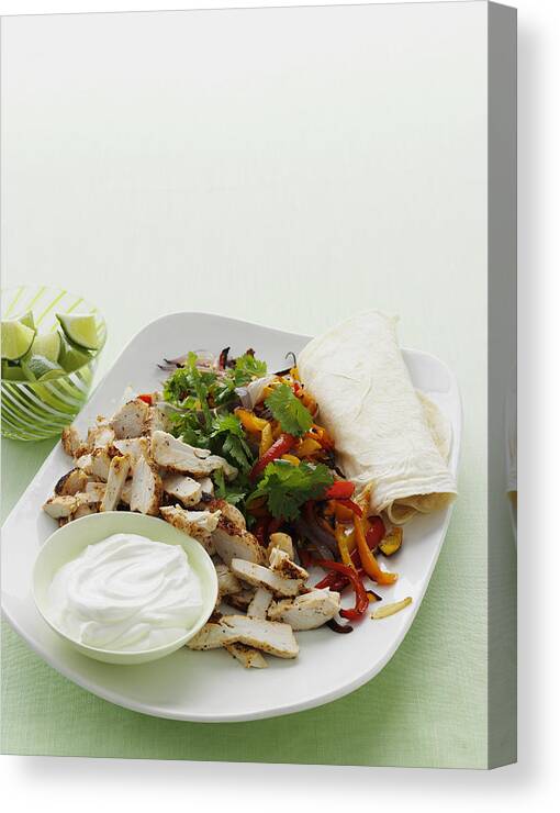 Vertical Canvas Print featuring the photograph Plate Of Spicy Chicken Burrito by Cultura/BRETT STEVENS