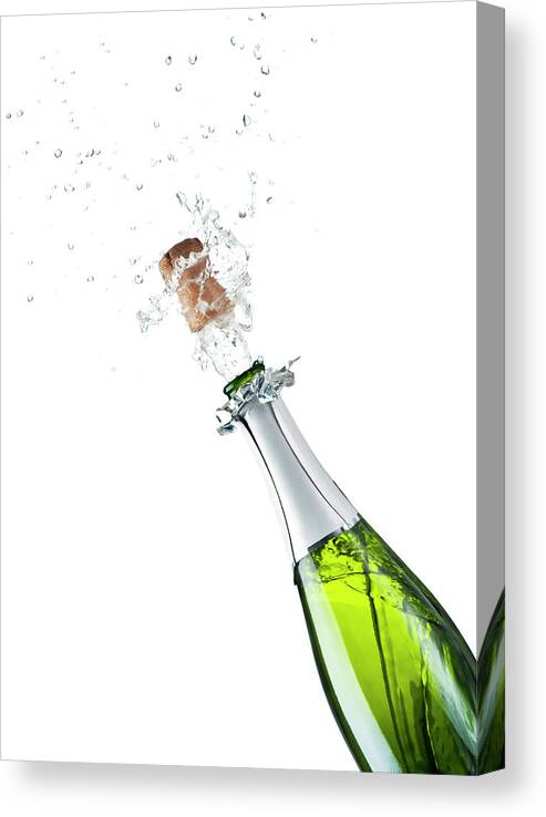 Releasing Canvas Print featuring the photograph Champagne Bottle by Mphillips007