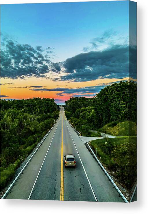 Clouds Canvas Print featuring the photograph The Road To Adventure by Jim Feldman