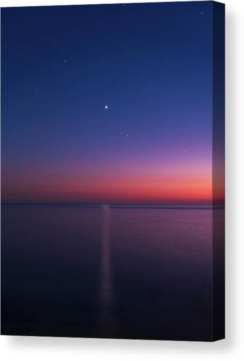Dusk Canvas Print featuring the photograph Venus's reflection over the sea at dusk by Mirko Chessari