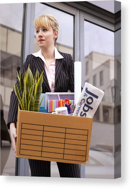 Problems Canvas Print featuring the photograph Young business woman made redundant by Peter Dazeley