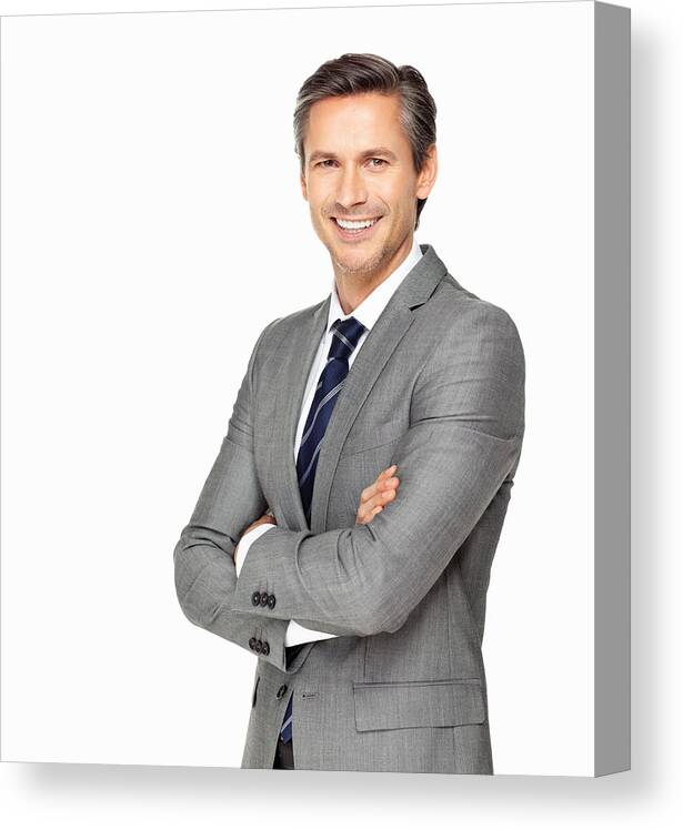 Mature Adult Canvas Print featuring the photograph Business man smiling with arms crossed by GlobalStock