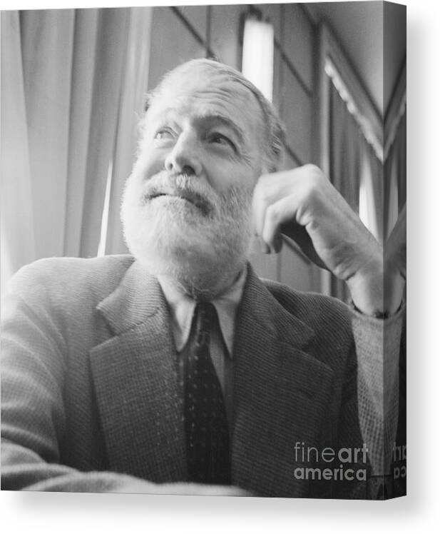 Ernest Hemingway Canvas Print featuring the photograph Portrait Of Writer Ernest Hemingway by Bettmann