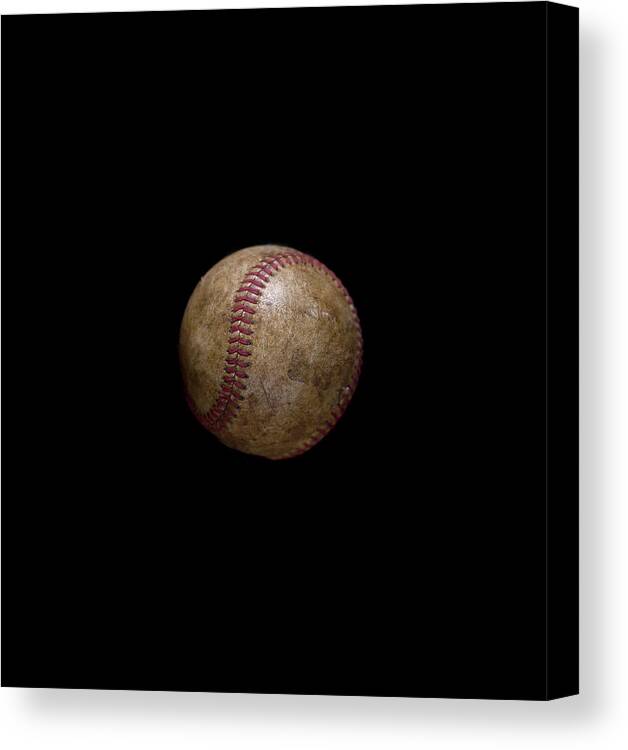 Black Background Canvas Print featuring the photograph Vintage Baseball On Black Background by Chris Parsons