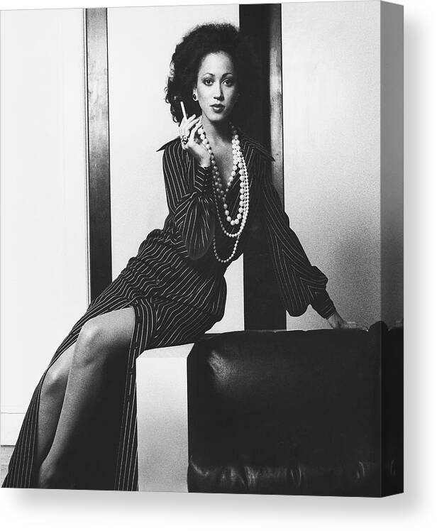 Fashion Canvas Print featuring the photograph Pat Cleveland Holding A Cigarette by Bob Stone