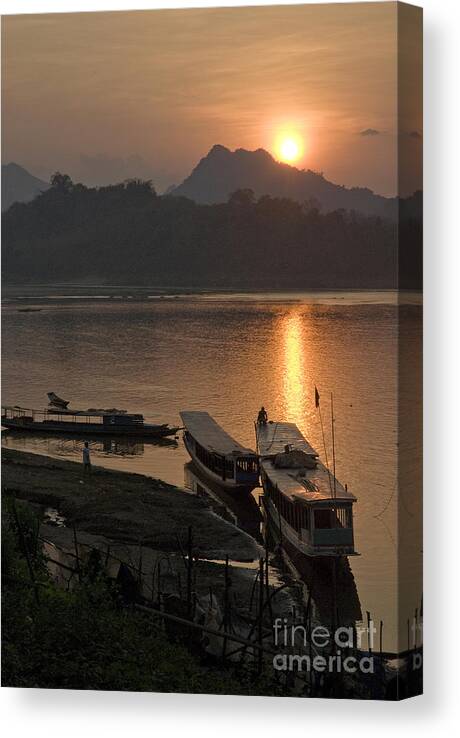 Luang Prabang Laos Asia Sunset River Boats Sunset Canvas Print featuring the photograph Boats On River By Luang Prabang Laos by JM Travel Photography