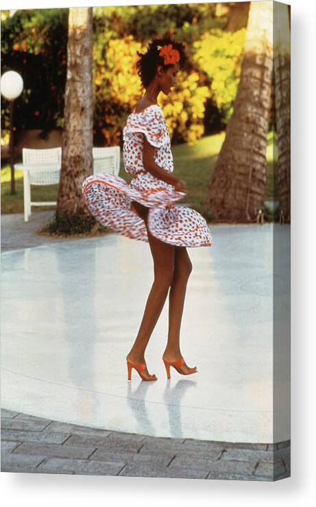 Model Canvas Print featuring the photograph Iman Dancing In A Yves Saint Laurent Dress by Kourken Pakchanian