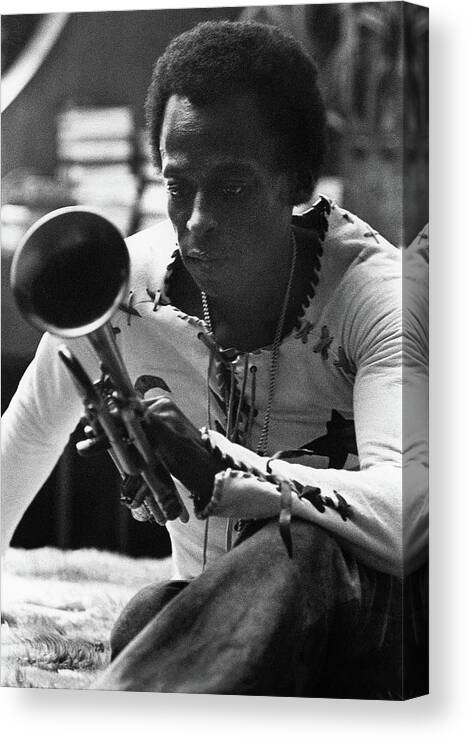 Artist Canvas Print featuring the photograph Jazz Musician Miles Davis Looking At His Trumpet by Mark Patiky