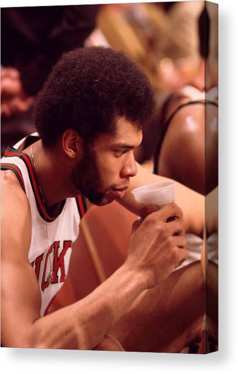 Marvin Newman Canvas Print featuring the photograph Kareem Abdul Jabbar Takes A Drink by Retro Images Archive