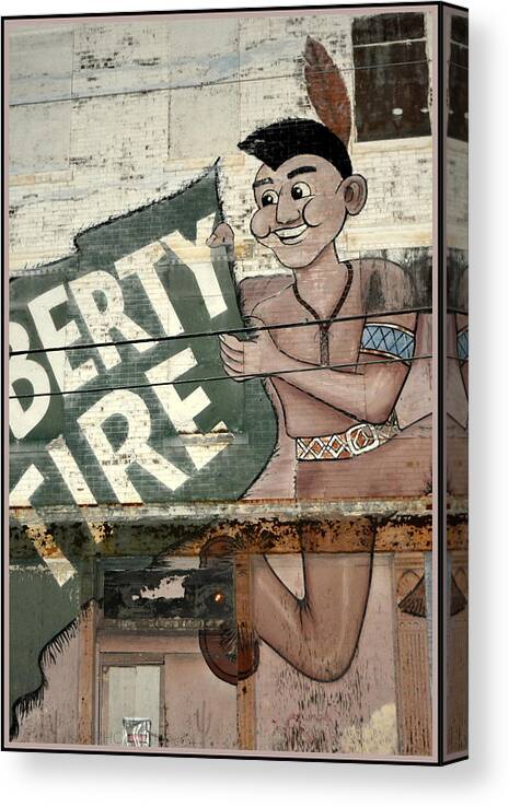 Graffiti Canvas Print featuring the photograph Liberty Tire III by Kathy Barney