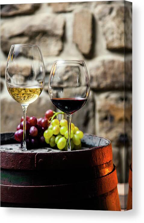 Alcohol Canvas Print featuring the photograph Two Glasses Of Red And White Wine In by Piranka