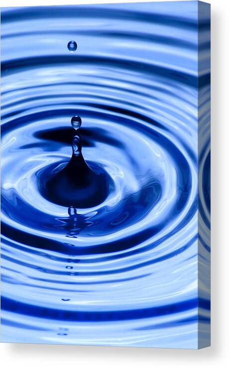 Water Drops Canvas Print featuring the photograph A Splash of Color #1 by Michael Dorn