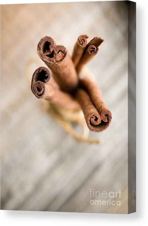 Aromatic Canvas Print featuring the photograph Cinnamon sticks #1 by Kati Finell