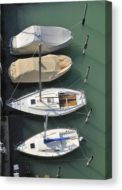 Boats Canvas Print featuring the photograph Boats and water from above by Matthias Hauser