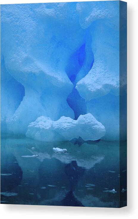 Hhh Canvas Print featuring the photograph Eroded Base Of Iceberg In Snowstorm by Colin Monteath