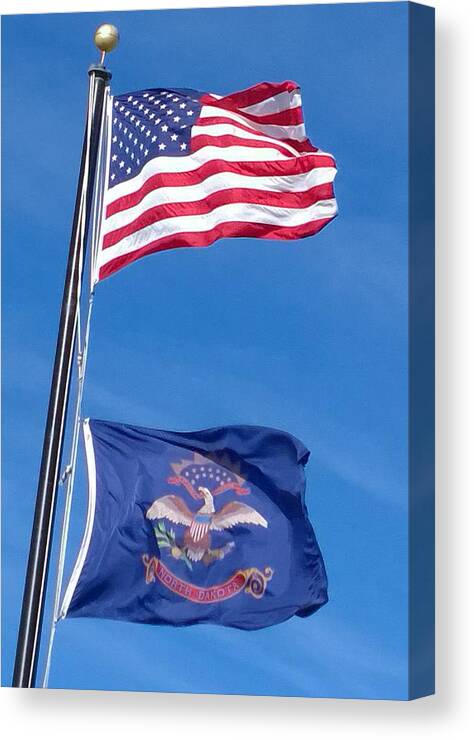 Photograph Canvas Print featuring the photograph American North Dakota Flags by Delynn Addams