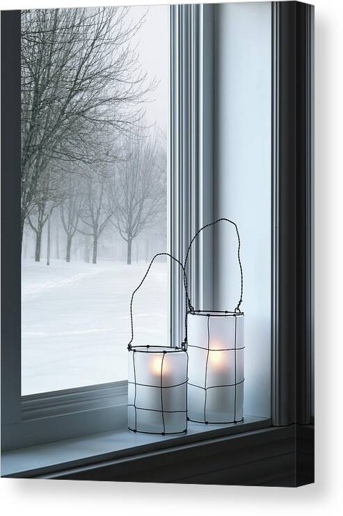 Lantern Canvas Print featuring the photograph Cozy lanterns and winter landscape seen through the window by GoodMood Art