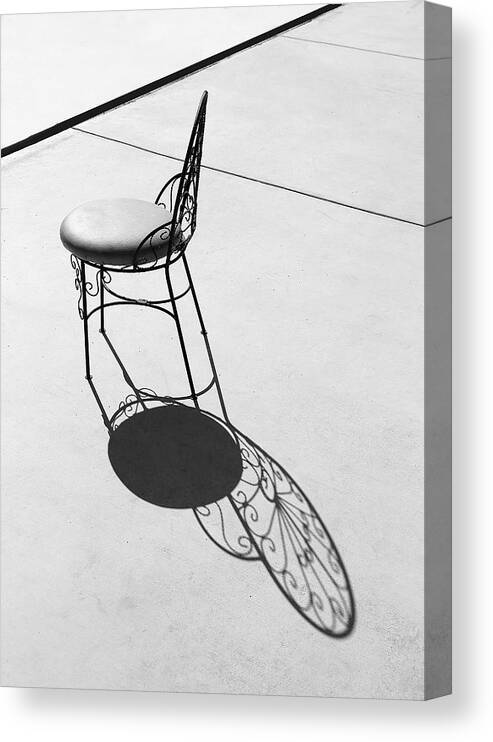 Iron Chair And Its Butterfly Shadow Canvas Print featuring the photograph Iron Chair And Its Butterfly Shadow by Viktor Savchenko
