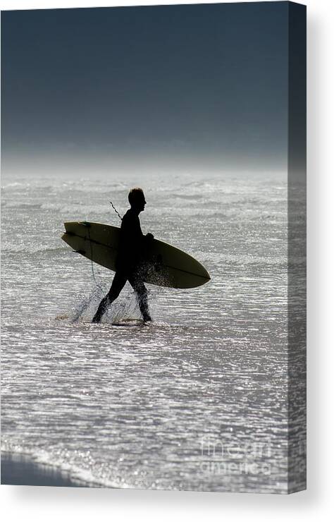 Surfing Canvas Print featuring the photograph Silhouette Surfer at Beach by Andreas Berthold