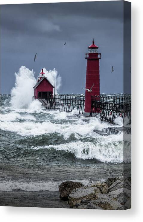 Lighthouse Canvas Print featuring the photograph Storm on Lake Michigan by the Grand Haven Lighthouse with Flying Gulls by Randall Nyhof
