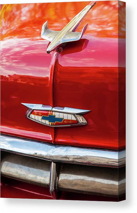 Vintage Chevy Hood Ornament Havana Cuba Photography By Charles Harden Red Candy Apple Smooth Chrome Antique Jet Plane Glossy Gloss Canvas Print featuring the photograph Vintage Chevy Hood Ornament Havana Cuba by Charles Harden