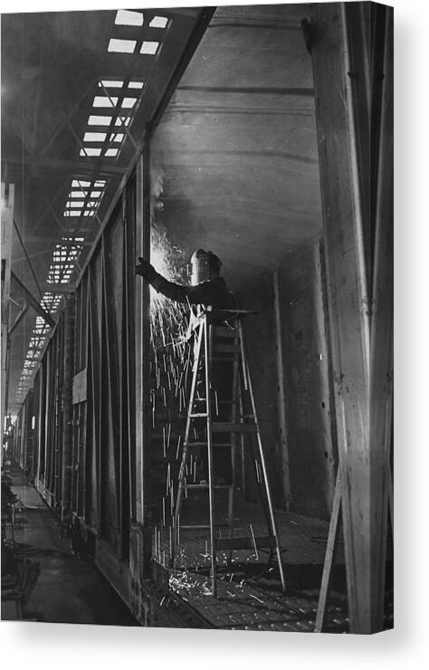 Iowa Canvas Print featuring the photograph Welder Works on Box Car at Machine Shop by Chicago and North Western Historical Society