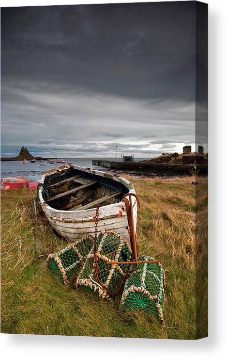 Scenics Canvas Print featuring the photograph A Weathered Boat And Fishing Equipment by John Short / Design Pics