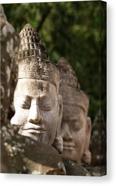 Engraving Canvas Print featuring the photograph Buddha Head Sculpture In A Row by Joakimbkk