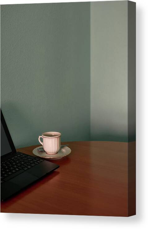 Computer Canvas Print featuring the photograph Coffee Cup And A Tablet On A Corner Table. Conceptual Image by Cavan Images