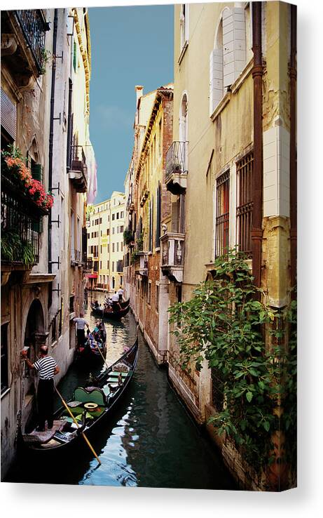 Working Canvas Print featuring the photograph Gondoliers And Gondolas On Canal In by Medioimages/photodisc