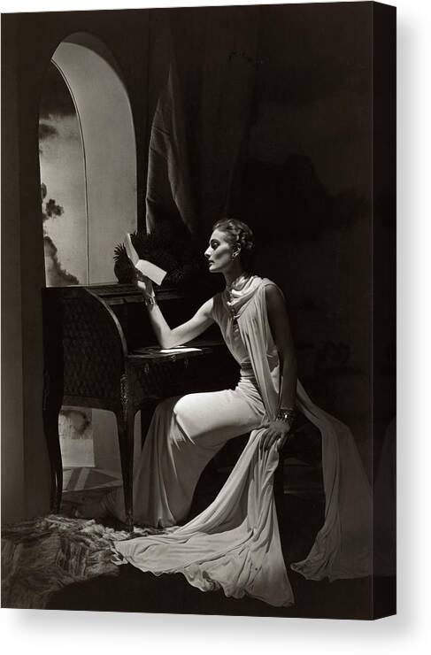 #new2022vogue Canvas Print featuring the photograph Model Reading At A Roll-top Desk by Horst P Horst