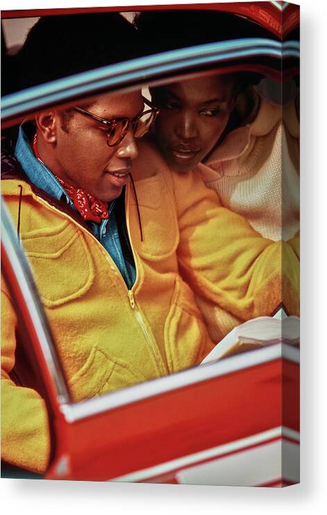 #new2022 Canvas Print featuring the photograph Models Sitting In A Red Car by Jacques Malignon