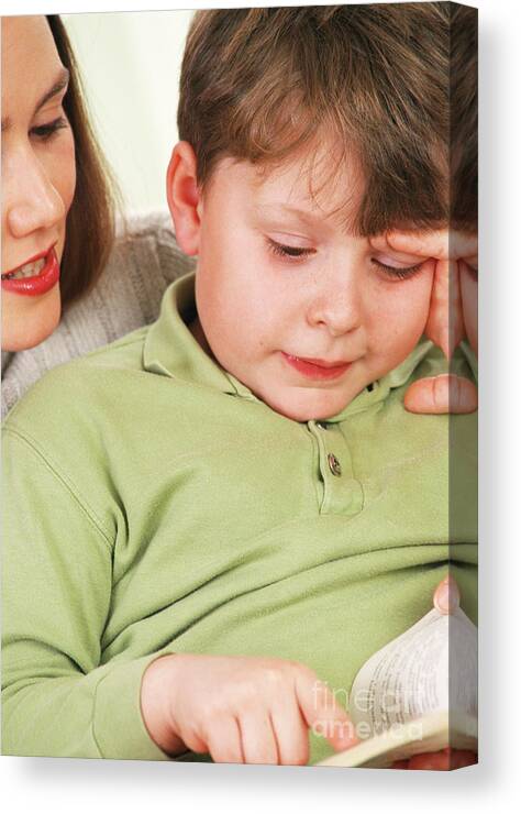 Boy Canvas Print featuring the photograph Mother And Son Reading by Lea Paterson/science Photo Library