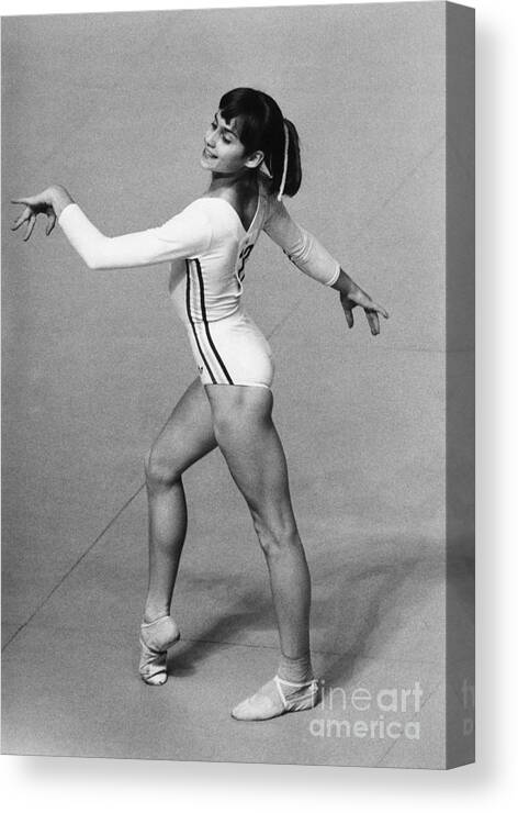 Child Canvas Print featuring the photograph Nadia Comaneci Performing In Floor by Bettmann