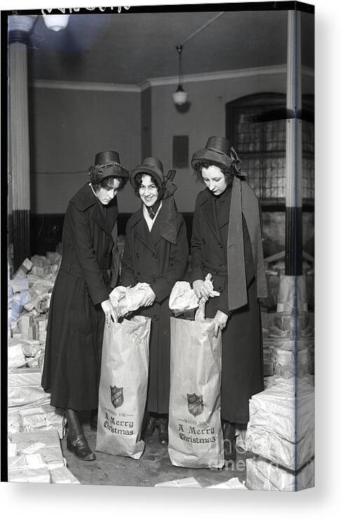 People Canvas Print featuring the photograph Salvation Army Women Filling Baskets by Bettmann