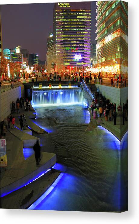 Crowd Canvas Print featuring the photograph The Cheonggyecheon Stream Draws Crowds by Lonely Planet