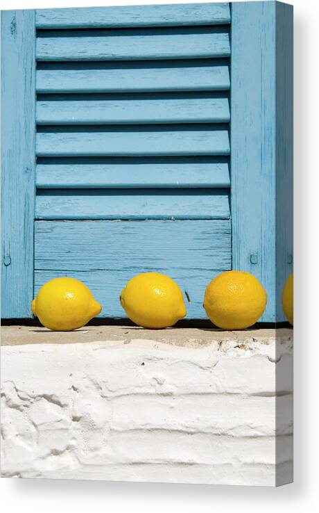 Greece Canvas Print featuring the photograph Three Lemons In A Window by Frankvandenbergh