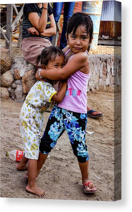 Local Canvas Print featuring the photograph Tough Love - Sea Gypsy Village, Flores, Indonesia by Earth And Spirit
