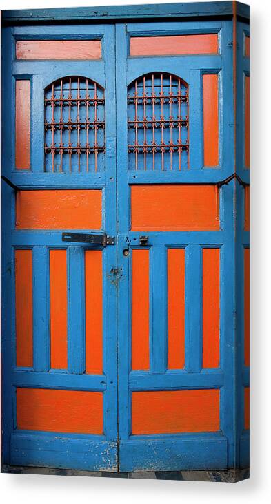 Arch Canvas Print featuring the photograph Bright Blue And Orange Door In Nicaragua by Anknet
