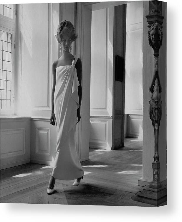 Fashion Canvas Print featuring the photograph A Model Wearing A Jean Louis Gown by Horst P. Horst