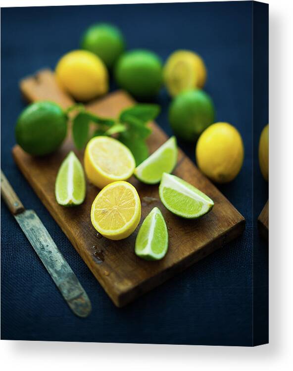 Orange Color Canvas Print featuring the photograph Lemons And Limes by Thepalmer