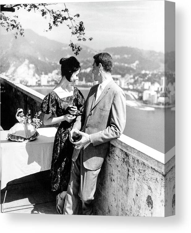 Rio De Janeiro Canvas Print featuring the photograph Models Holding Wine On A Balcony by Richard Waite