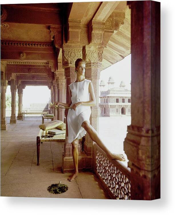 Fashion Canvas Print featuring the photograph Veruschka Wearing A John Moore Dress by Henry Clarke