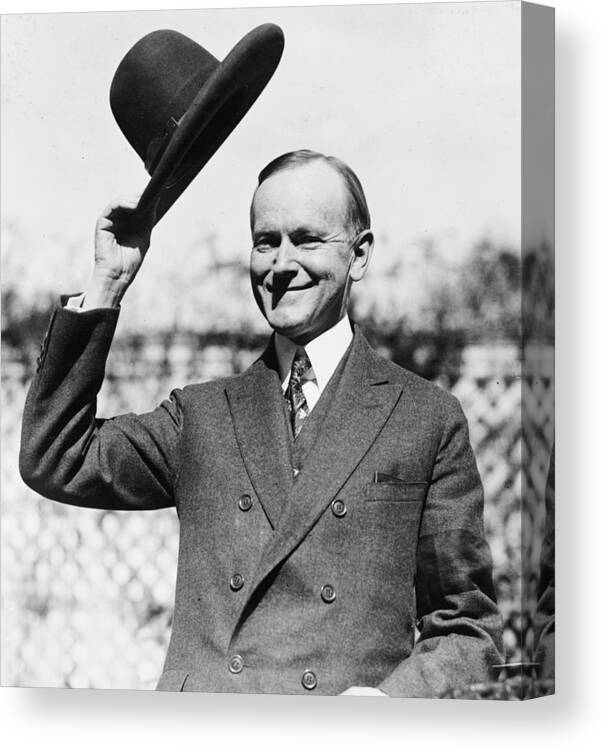 president Calvin Coolidge Canvas Print featuring the photograph President Calvin Coolidge tips is hat by International Images