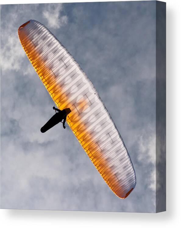 Paraglider Canvas Print featuring the photograph Sunlit Paraglider by Bel Menpes