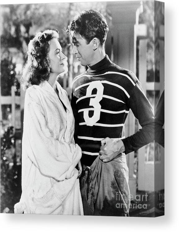 Jimmy Stewart Canvas Print featuring the photograph Donna Reed And James Stewart by Bettmann