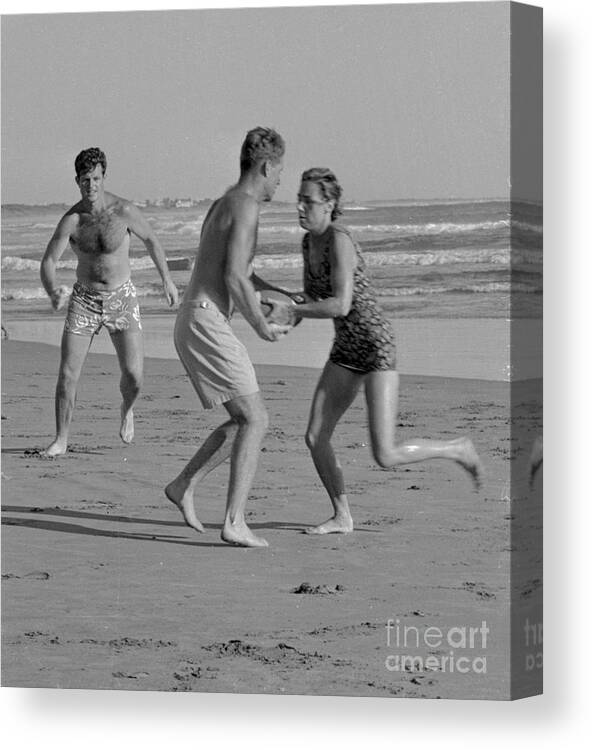 People Canvas Print featuring the photograph Kennedys Playing Football On Beach by Bettmann