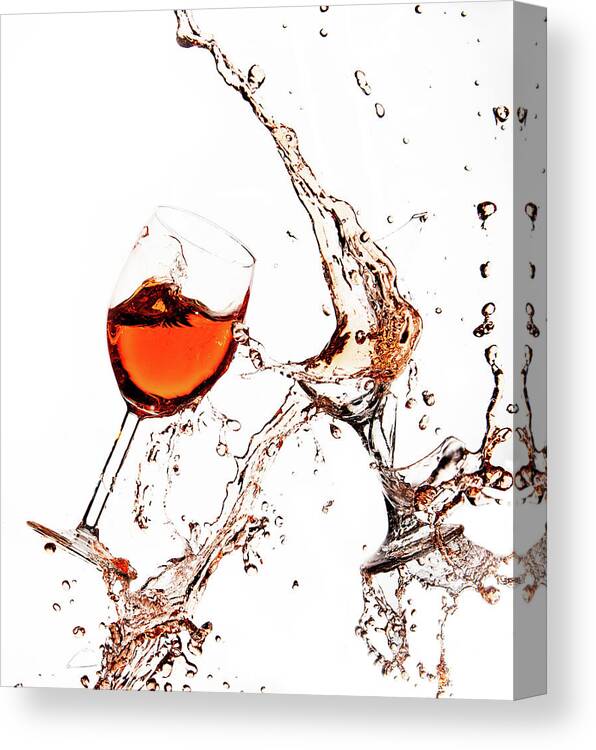 Damaged Canvas Print featuring the photograph Broken wine glasses with wine splashes on a white background by Michalakis Ppalis
