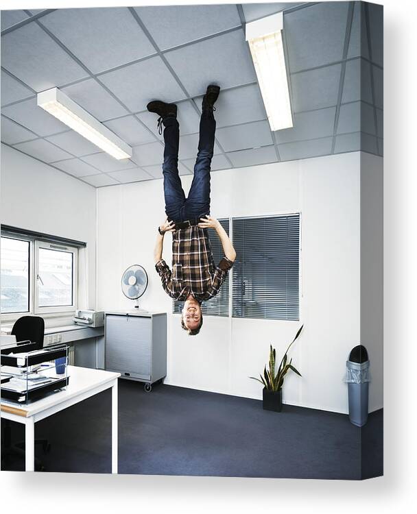 Ceiling Canvas Print featuring the photograph Man standing upside down on the ceiling. by Henrik Sorensen