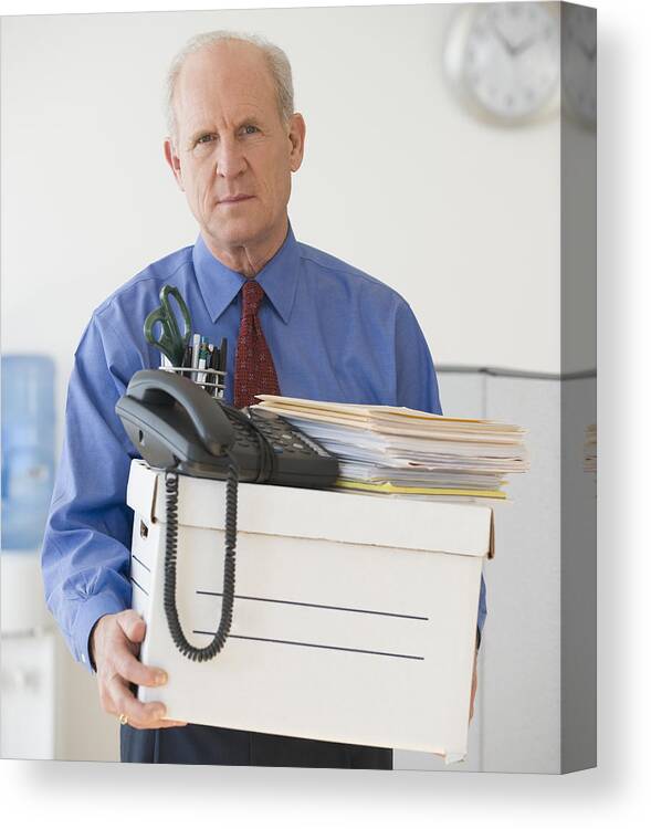 Problems Canvas Print featuring the photograph Senior businessman carrying box of office items by Tetra Images